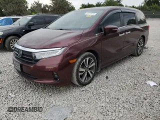 2021 Honda Odyssey Touring with VIN 5FNRL6H87MB003366, listed as a Copart auction lot 62810075 with 57,274 mi miles and Salvage title. Bid and sale history available at DreamBid. Image 1.