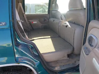 1997 Chevrolet Tahoe with VIN 1GNEK13RXVJ375189, listed as a IAAI auction lot 41959601 with 153,589 mi miles. Bid and sale history available at carsss.com. Image 8.