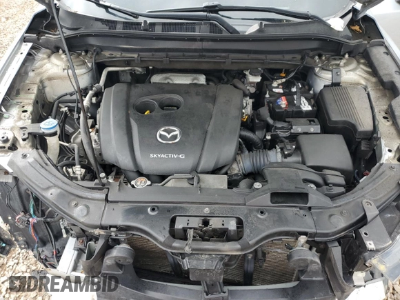 2020 Mazda CX-5 Touring z VIN JM3KFBCM2L0750223, wystawiony jako Copart lot #56300415 z przebiegiem 87 392 mil mil oraz Szkoda całkowita • Salvage title. Historia ofert i sprzedaży dostępna na DreamBid. Obrazek 12.