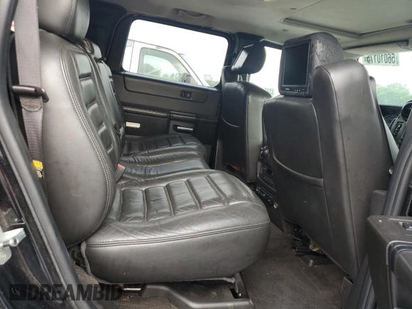 2006 Hummer H2 z VIN 5GRGN23U66H116855, wystawiony jako Copart lot #56010175 z przebiegiem 217 798 mil mil oraz Tytuł czysty. Historia ofert i sprzedaży dostępna na DreamBid. Obrazek 11.