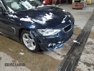 2015 BMW 4 Series 428i xDrive with VIN WBA4A7C57FD414955, listed as a IAAI auction lot 41609214 with 69,125 mi miles and . Bid and sale history available at DreamBid. Image 6.