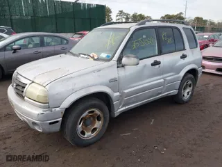 2002 Suzuki Grand Vitara JLX with VIN JS3TD62V724153257, listed as a IAAI auction lot 41452635 with 999,999 mi miles. Bid and sale history available at carsss.com. Image 2.