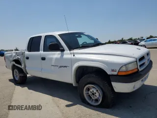 2000 Dodge Dakota Sport with VIN 1B7GG2AN8YS598547, listed as a Copart auction lot 54520985 with 244,605 mi miles and Salvage Title. Bid and sale history available at carsss.com. Image 4.