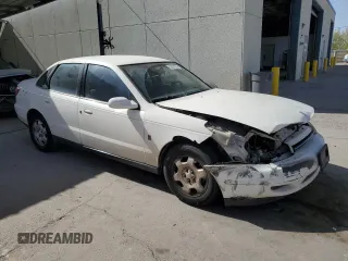2002 Saturn LS z VIN 1G8JW54R72Y576434, wystawiony jako Copart lot #55029305 z przebiegiem 135 613 mil mil oraz Szkody całkowita. Historia ofert i sprzedaży dostępna na DreamBid. Obrazek 4.