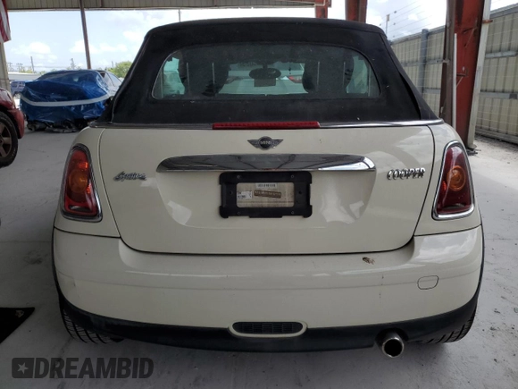 2010 MINI Convertible with VIN WMWMR3C59ATU98597, listed as a Copart auction lot 53336025 with 88,273 mi miles and Salvage Title. Bid and sale history available at DreamBid. Image 6.