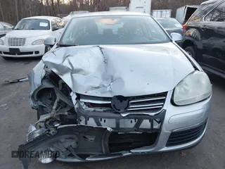 2009 Volkswagen Jetta Wolfsburg Edition with VIN 3VWRJ71K19M027857, listed as a IAAI auction lot 41312413 with 150,335 mi miles and . Bid and sale history available at DreamBid. Image 6.
