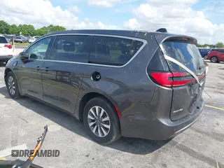 2023 Chrysler Pacifica Hybrid Touring L with VIN 2C4RC1L74PR579782, listed as a IAAI auction lot 42487390 with Not provided miles and . Bid and sale history available at DreamBid. Image 3.