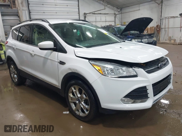 2014 Ford Escape SE with VIN 1FMCU9G99EUC15477, listed as a IAAI auction lot 42147162 with 98,886 mi miles and . Bid and sale history available at DreamBid. Image 1.