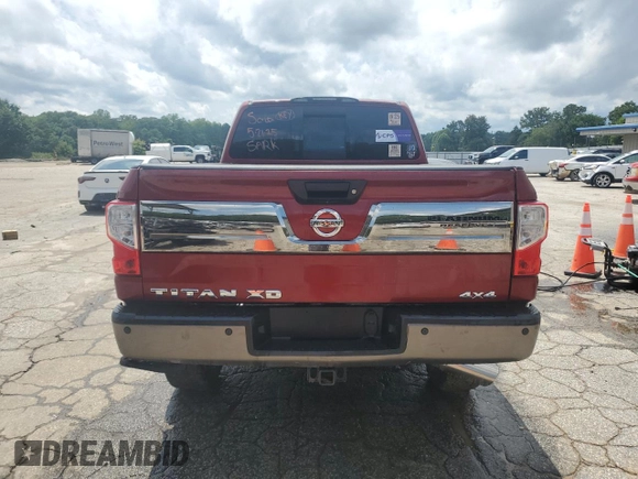 2017 Nissan Titan Pro-4X z VIN 1N6BA1F43HN562363, wystawiony jako Copart lot #58604115 z przebiegiem 102 412 mil mil oraz Czysty tytuł • Clean title. Historia ofert i sprzedaży dostępna na DreamBid. Obrazek 6.