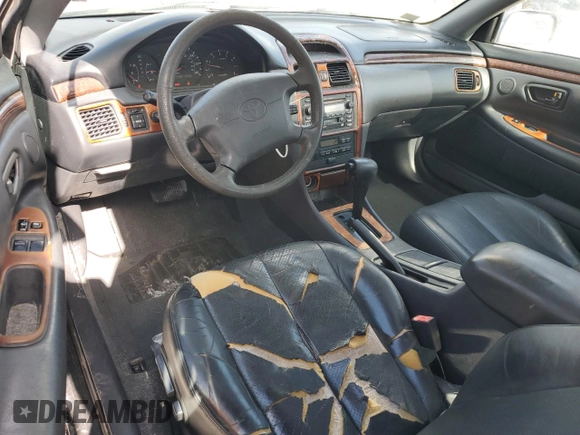 2000 Toyota Solara SE with VIN 2T1CF22P8YC357140, listed as a Copart auction lot 54100775 with 186,137 mi miles and Salvage Title. Bid and sale history available at DreamBid. Image 8.