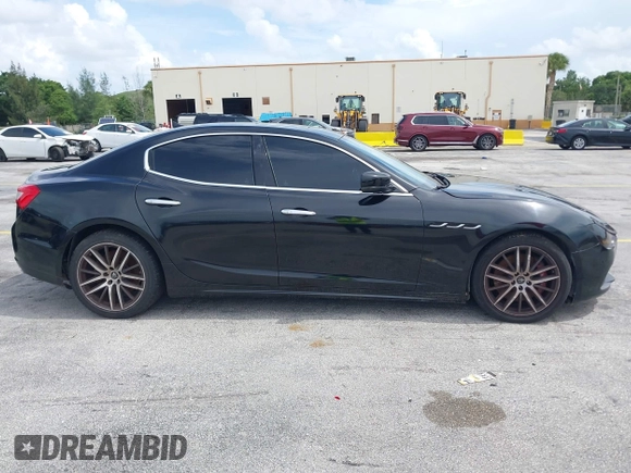2015 Maserati Ghibli with VIN ZAM57XSA1F1144073, listed as a IAAI auction lot 42770723 with 105,782 mi miles and . Bid and sale history available at DreamBid. Image 13.