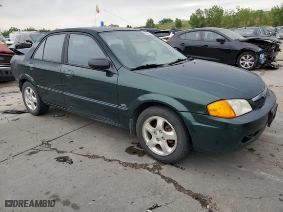 1999 Mazda Protege ES with VIN JM1BJ2210X0150711, listed as a Copart auction lot 57629144 with 175,754 mi miles and Salvage Title. Bid and sale history available at carsss.com. Image 4.