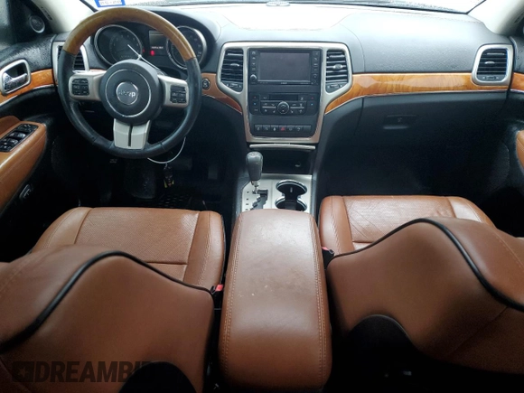 2013 Jeep Grand Cherokee Overland with VIN 1C4RJECT2DC590911, listed as a Copart auction lot 42939405 with 136,673 mi miles and Salvage Title. Bid and sale history available at carsss.com. Image 8.