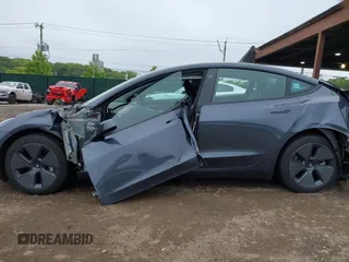 2023 Tesla Model 3 with VIN 5YJ3E1EA9PF673399, listed as a IAAI auction lot 42392643 with 7,571 mi miles and . Bid and sale history available at DreamBid. Image 15.