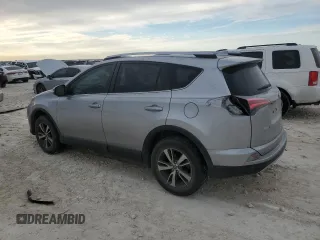 2018 Toyota RAV4 XLE with VIN JTMWFREV3JJ180152, listed as a Copart auction lot 46949465 with 103,346 mi miles and Clean Title. Bid and sale history available at DreamBid. Image 2.