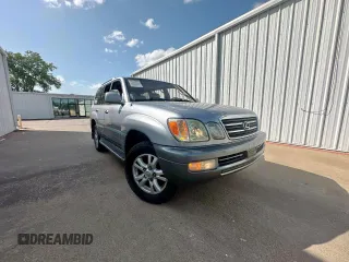 2003 Lexus LX 470 z VIN JTJHT00W933535214, wystawiony jako Copart lot #62037495 z przebiegiem 373 210 mil mil oraz Czysty tytuł • Clean title. Historia ofert i sprzedaży dostępna na DreamBid. Obrazek 1.