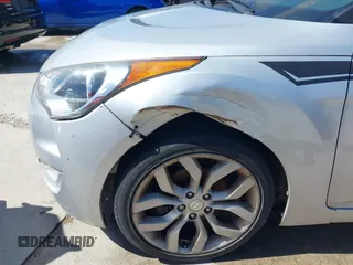 2013 Hyundai Veloster w/Black Int z VIN KMHTC6AD3DU092305, wystawiony jako IAAI lot #41721717 z przebiegiem 158 534 mil mil oraz . Historia ofert i sprzedaży dostępna na DreamBid. Obrazek 12.