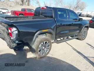 2024 GMC Canyon 4WD AT4 with VIN 1GTP6DEK9R1118926, listed as a IAAI auction lot 40998280 with 10,958 mi miles. Bid and sale history available at carsss.com. Image 4.