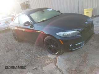 2015 BMW 2 Series 228i with VIN WBA1F5C55FV256604, listed as a IAAI auction lot 41841754 with 118,354 mi miles. Bid and sale history available at carsss.com. Image 1.