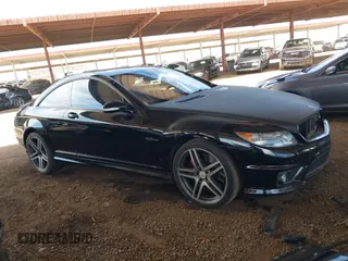 2009 Mercedes-Benz CL V8 AMG with VIN WDDEJ77X79A022220, listed as a IAAI auction lot 42095679 with 155,333 mi miles. Bid and sale history available at carsss.com. Image 1.