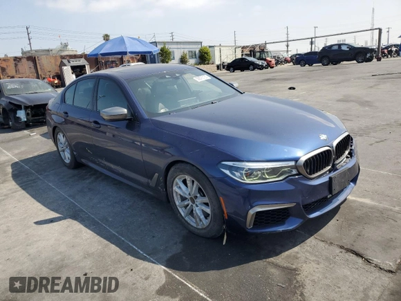 2019 BMW 5 Series M550i xDrive with VIN WBAJB9C51KB464722, listed as a Copart auction lot 53575135 with 70,187 mi miles and Salvage title. Bid and sale history available at DreamBid. Image 4.