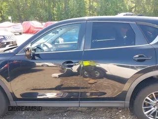 2017 Mazda CX-5 Touring z VIN JM3KFBCL0H0209458, wystawiony jako IAAI lot #42169599 z przebiegiem 93 287 mil mil oraz . Historia ofert i sprzedaży dostępna na DreamBid. Obrazek 14.