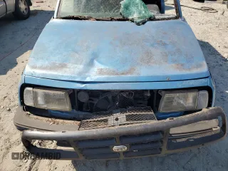 1995 Geo Tracker z VIN 2CNBE18UXS6930601, wystawiony jako Copart lot #76079094 z przebiegiem 276 136 mil mil oraz Szkody całkowita. Historia ofert i sprzedaży dostępna na DreamBid. Obrazek 11.