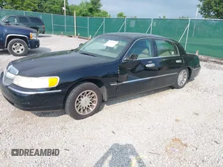 2001 Lincoln Town Car Signature with VIN 1LNHM82W11Y613959, listed as a IAAI auction lot 42432229 with 144,660 mi miles and . Bid and sale history available at DreamBid. Image 2.