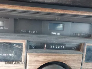 1985 Cadillac Seville z VIN 1G6KS698XFE804240, wystawiony jako IAAI lot #42125052 z przebiegiem 11 322 mil mil oraz . Historia ofert i sprzedaży dostępna na DreamBid. Obrazek 7.