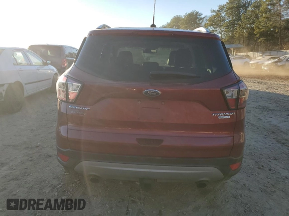 2017 Ford Escape Titanium with VIN 1FMCU0J94HUD34112, listed as a Copart auction lot 85837974 with 127,576 mi miles and Salvage Title. Bid and sale history available at carsss.com. Image 6.