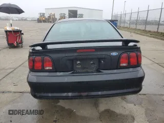 1997 Ford Mustang with VIN 1FALP4049VF136060, listed as a Copart auction lot 85389824 with 0 mi miles and Salvage Title. Bid and sale history available at carsss.com. Image 6.