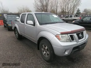 2011 Nissan Frontier PRO-4X with VIN 1N6AD0EV2BC438370, listed as a IAAI auction lot 41952484 with 217,529 mi miles. Bid and sale history available at carsss.com. Image 1.