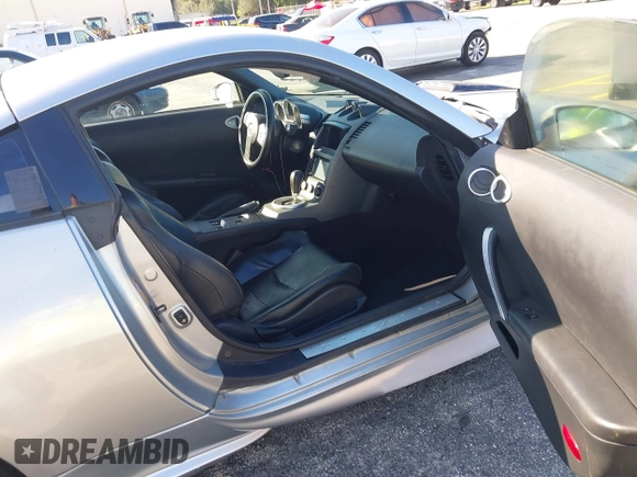 2003 Nissan 350Z Touring z VIN JN1AZ34E23T019866, wystawiony jako IAAI lot #41293510 z przebiegiem 118 416 mil mil oraz . Historia ofert i sprzedaży dostępna na DreamBid. Obrazek 5.