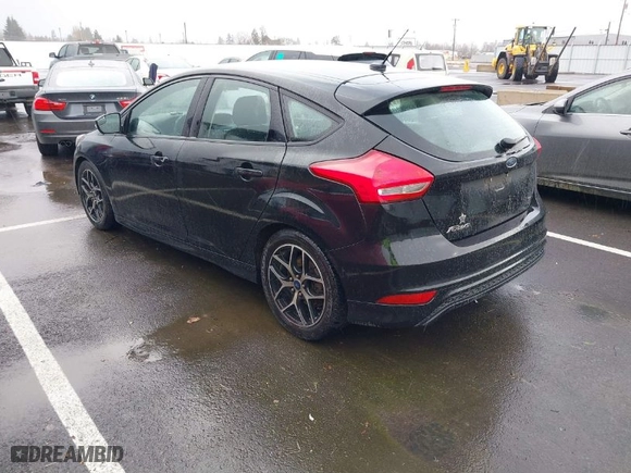 2015 Ford Focus SE with VIN 1FADP3K24FL370068, listed as a IAAI auction lot 41664236 with 328,569 mi miles. Bid and sale history available at carsss.com. Image 3.