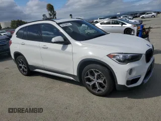 2017 BMW X1 sDrive28i with VIN WBXHU7C39H5H37756, listed as a Copart auction lot 50769975 with 82,479 mi miles and Salvage Title. Bid and sale history available at carsss.com. Image 4.