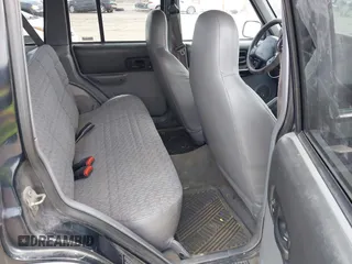 1998 Jeep Cherokee Sport with VIN 1J4FJ68S3WL285200, listed as a IAAI auction lot 41834529 with 335,881 mi miles and . Bid and sale history available at DreamBid. Image 8.