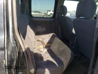 2000 Nissan Frontier XE z VIN 1N6ED27Y3YC324102, wystawiony jako Copart lot #56922155 z przebiegiem 202 233 mil mil oraz Szkoda całkowita • Salvage title. Historia ofert i sprzedaży dostępna na DreamBid. Obrazek 10.