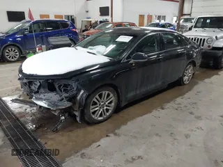 2015 Lincoln MKZ Hybrid with VIN 3LN6L2LU9FR623245, listed as a IAAI auction lot 41599726 with 202,108 mi miles. Bid and sale history available at carsss.com. Image 2.