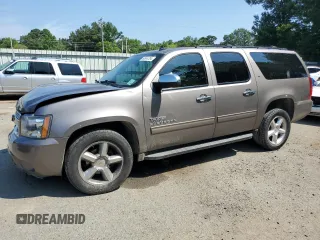 2013 Chevrolet Suburban LT with VIN 1GNSCJE07DR104489, listed as a Copart auction lot 60844784 with 185,420 mi miles and Salvage Title. Bid and sale history available at carsss.com. Image 1.
