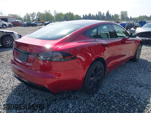 2023 Tesla Model S with VIN 5YJSA1E5XPF516779, listed as a IAAI auction lot 42110737 with 16,465 mi miles and . Bid and sale history available at DreamBid. Image 4.