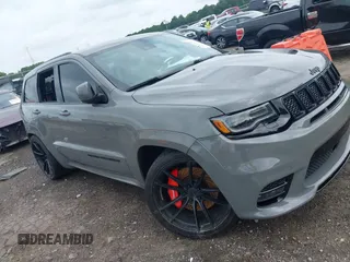 2020 Jeep Grand Cherokee SRT with VIN 1C4RJFDJ0LC254532, listed as a IAAI auction lot 42492572 with 71,639 mi miles and . Bid and sale history available at DreamBid. Image 1.
