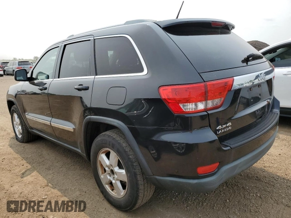 2011 Jeep Grand Cherokee Laredo with VIN 1J4RR4GGXBC567450, listed as a Copart auction lot 60056085 with 165,077 mi miles and Salvage title. Bid and sale history available at DreamBid. Image 2.