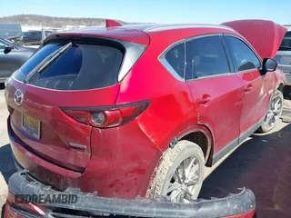 2020 Mazda CX-5 Grand Touring with VIN JM3KFADM3L0761286, listed as a IAAI auction lot 41715379 with 145,656 mi miles and . Bid and sale history available at DreamBid. Image 3.