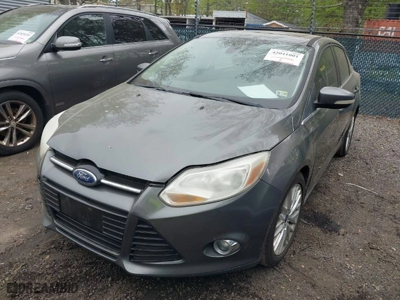 2012 Ford Focus SEL with VIN 1FAHP3H23CL348356, listed as a IAAI auction lot 42041001 with 174,510 mi miles. Bid and sale history available at carsss.com. Image 2.