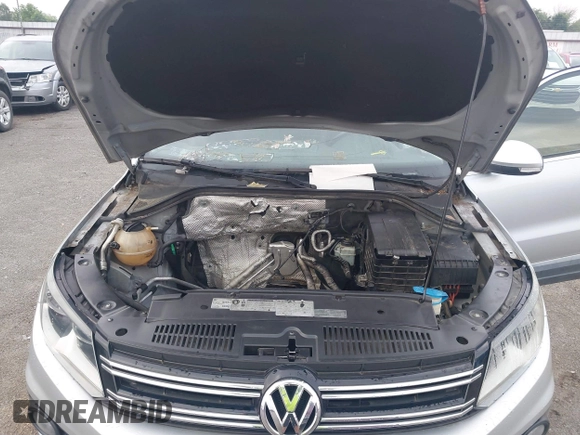 2012 Volkswagen Tiguan SE z VIN WVGAV7AX4CW520340, wystawiony jako IAAI lot #42294414 z przebiegiem 120 009 mil mil oraz . Historia ofert i sprzedaży dostępna na DreamBid. Obrazek 10.