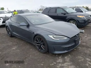 2021 Tesla Model S Long Range with VIN 5YJSA1E5XMF428519, listed as a IAAI auction lot 41926242 with 54,284 mi miles and . Bid and sale history available at DreamBid. Image 1.