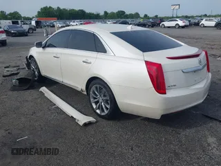 2013 Cadillac XTS with VIN 2G61N5S39D9145885, listed as a IAAI auction lot 42044388 with 181,645 mi miles and . Bid and sale history available at DreamBid. Image 3.