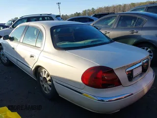 2001 Lincoln Continental with VIN 1LNHM97V71Y670611, listed as a IAAI auction lot 41385621 with 141,714 mi miles. Bid and sale history available at carsss.com. Image 3.