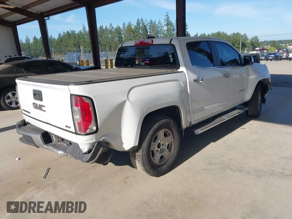 2015 GMC Canyon 2WD SLE with VIN 1GTG5CEA1F1273955, listed as a IAAI auction lot 42392908 with 79,981 mi miles and . Bid and sale history available at DreamBid. Image 4.
