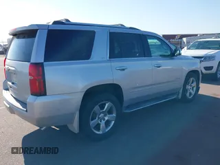2015 Chevrolet Tahoe LTZ with VIN 1GNSKCKC5FR205739, listed as a IAAI auction lot 40020644 with 142,524 mi miles and . Bid and sale history available at DreamBid. Image 4.